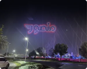 Mansour festival event branding with neon lights at night