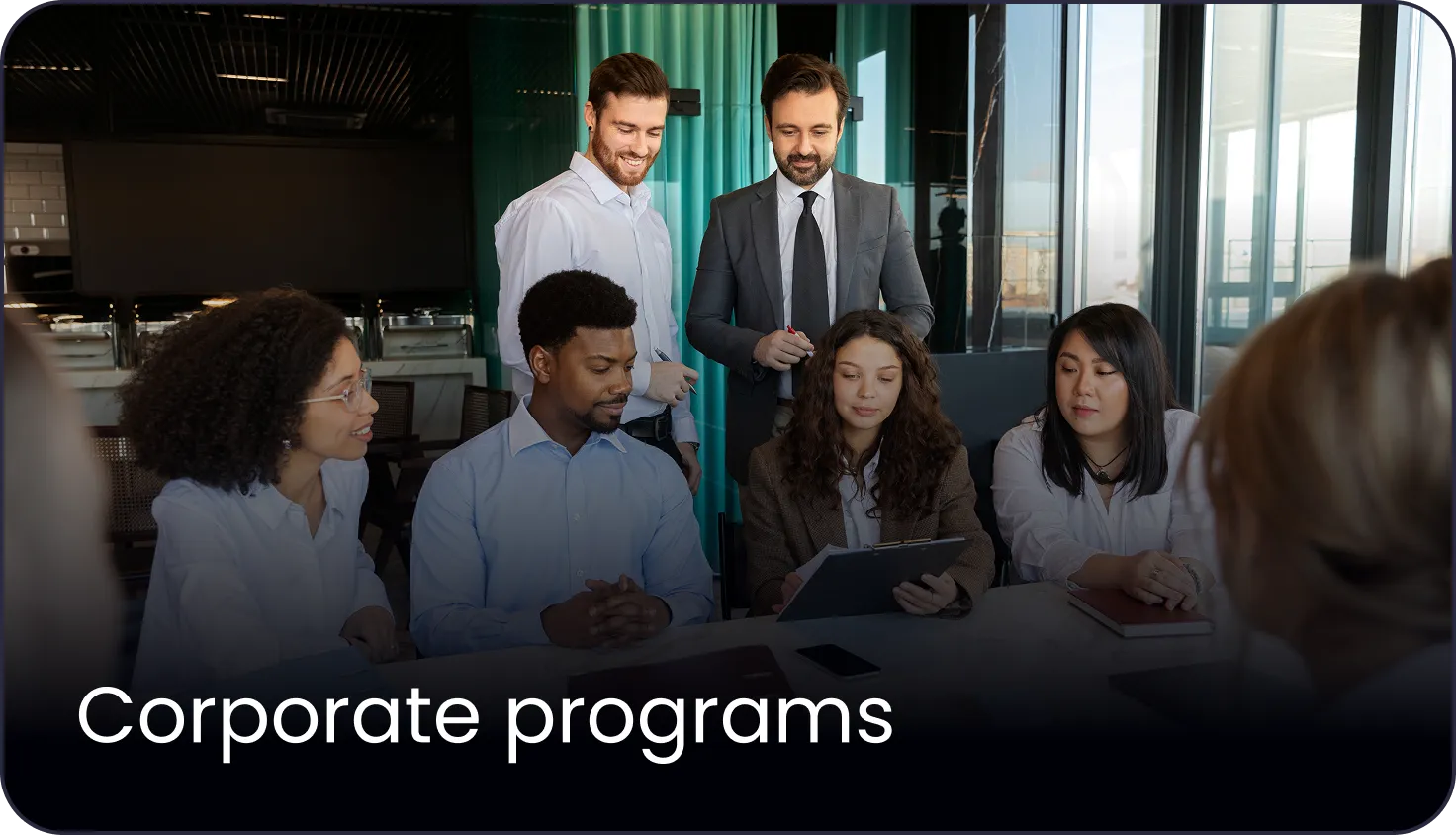 Business professionals in a modern office meeting room having a corporate program discussion